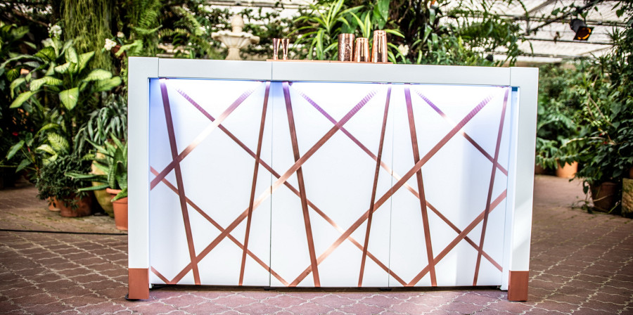 white bar with copper applications and copper inlays